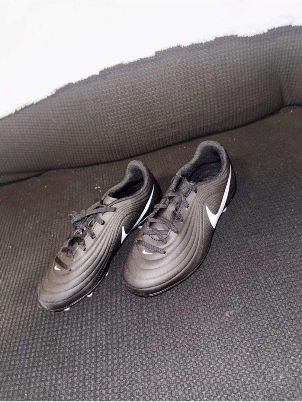 Nike kids unisex Black Athletic Soccer Shoes with White Swoosh